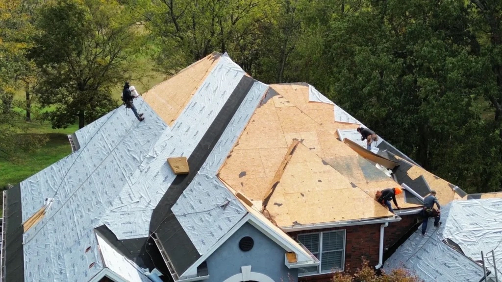 Roof installation crew preparing a residential home